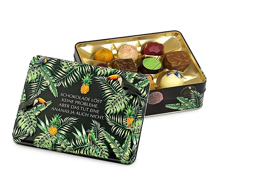 Präsentdose "Schokolade löst keine Probleme, aber das tut eine Ananas ja auch nicht" 125g, Manufakturqualität!, handgefertigt von den Konditoren der Confiserie Rabbel...für ein Lächeln mehr am Tag